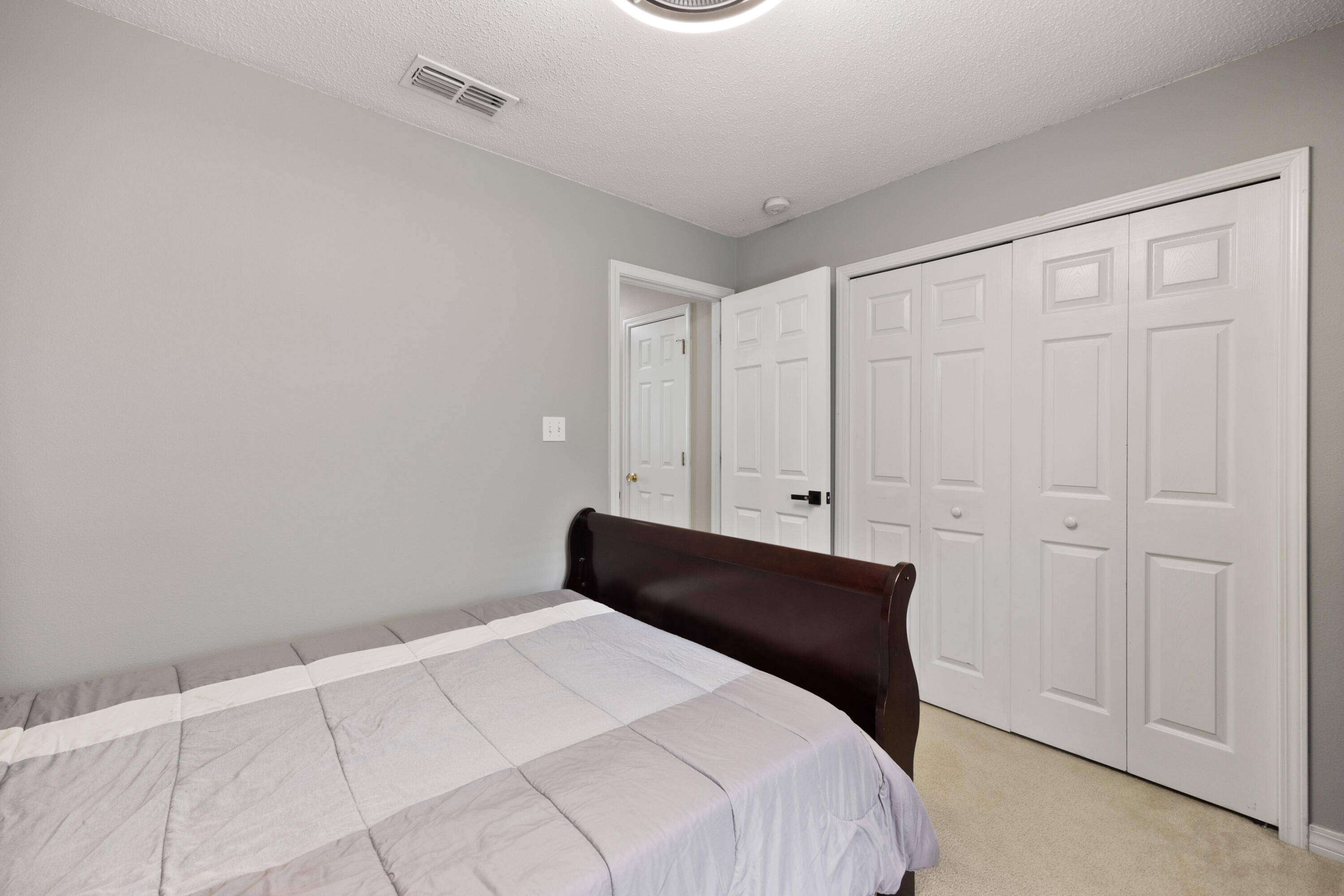143 Sandstone Trail Crestview, FL 32539 - Photo 26 of 40 a bedroom with a bed and a window
