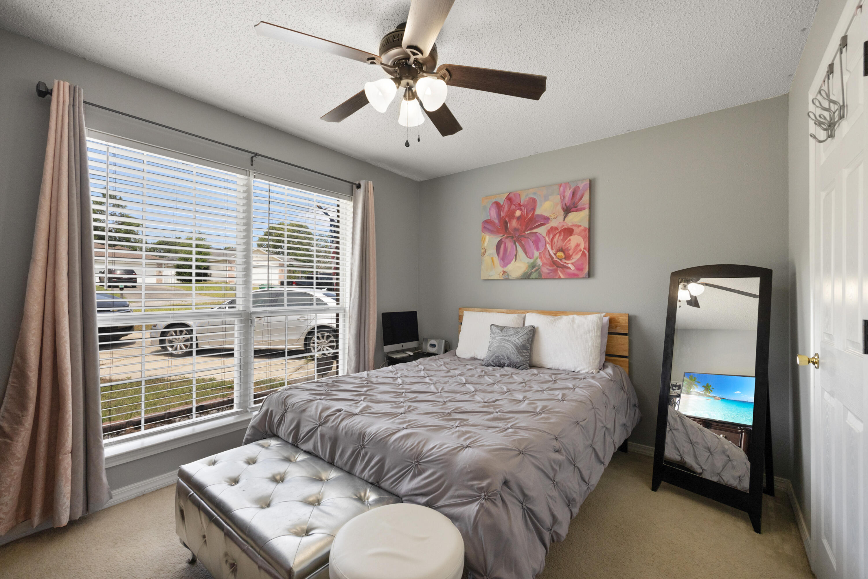143 Sandstone Trail Crestview, FL 32539 - Photo 27 of 40 a bedroom with a bed and a painting on the wall