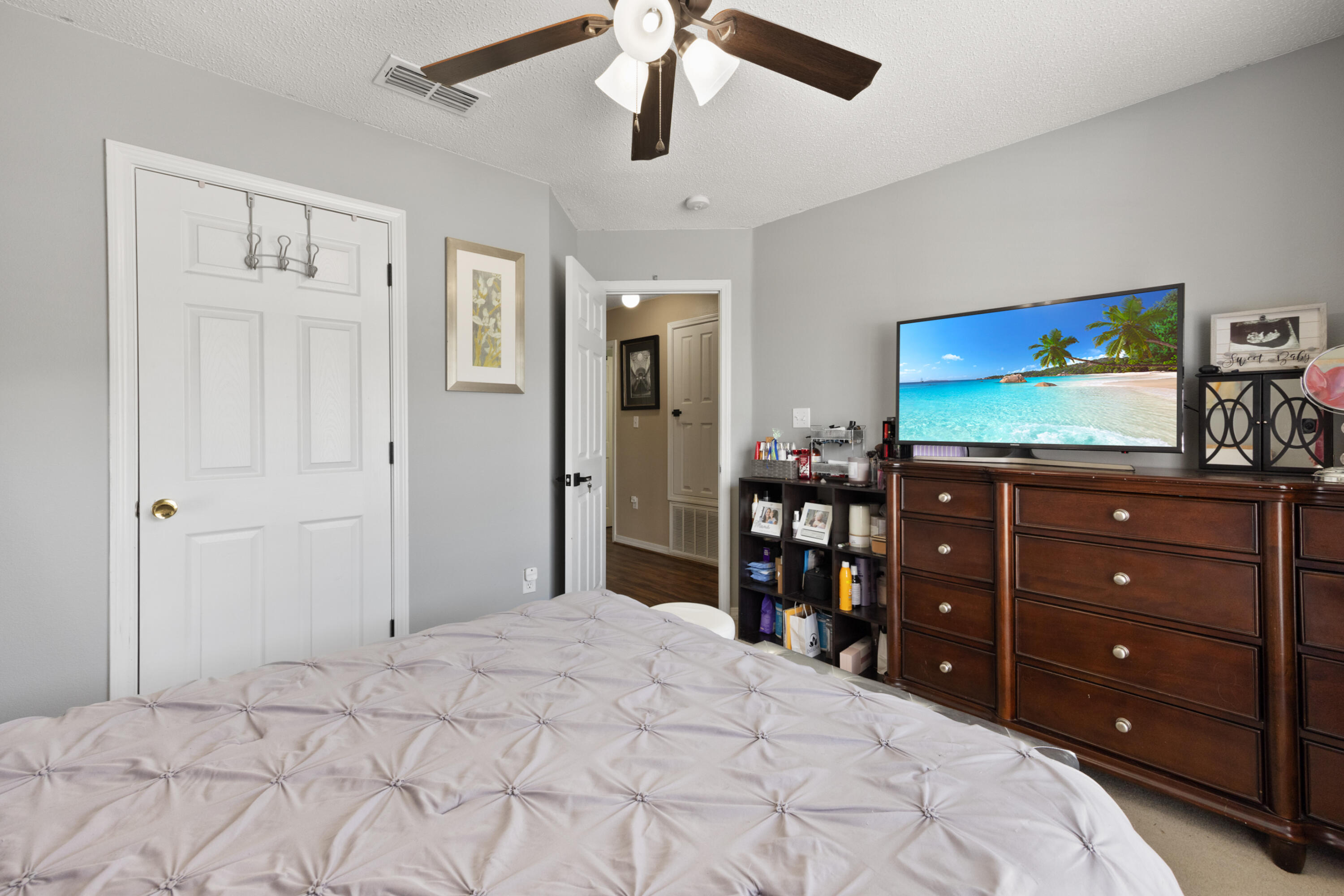 143 Sandstone Trail Crestview, FL 32539 - Photo 28 of 40 a bedroom with a bed and a flat screen tv