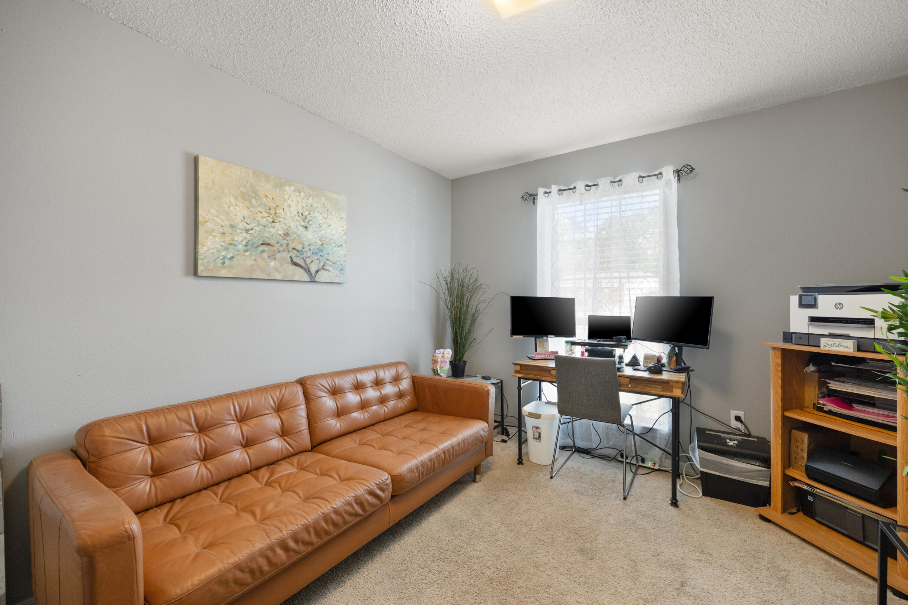 143 Sandstone Trail Crestview, FL 32539 - Photo 29 of 40 a living room with furniture and a flat screen tv