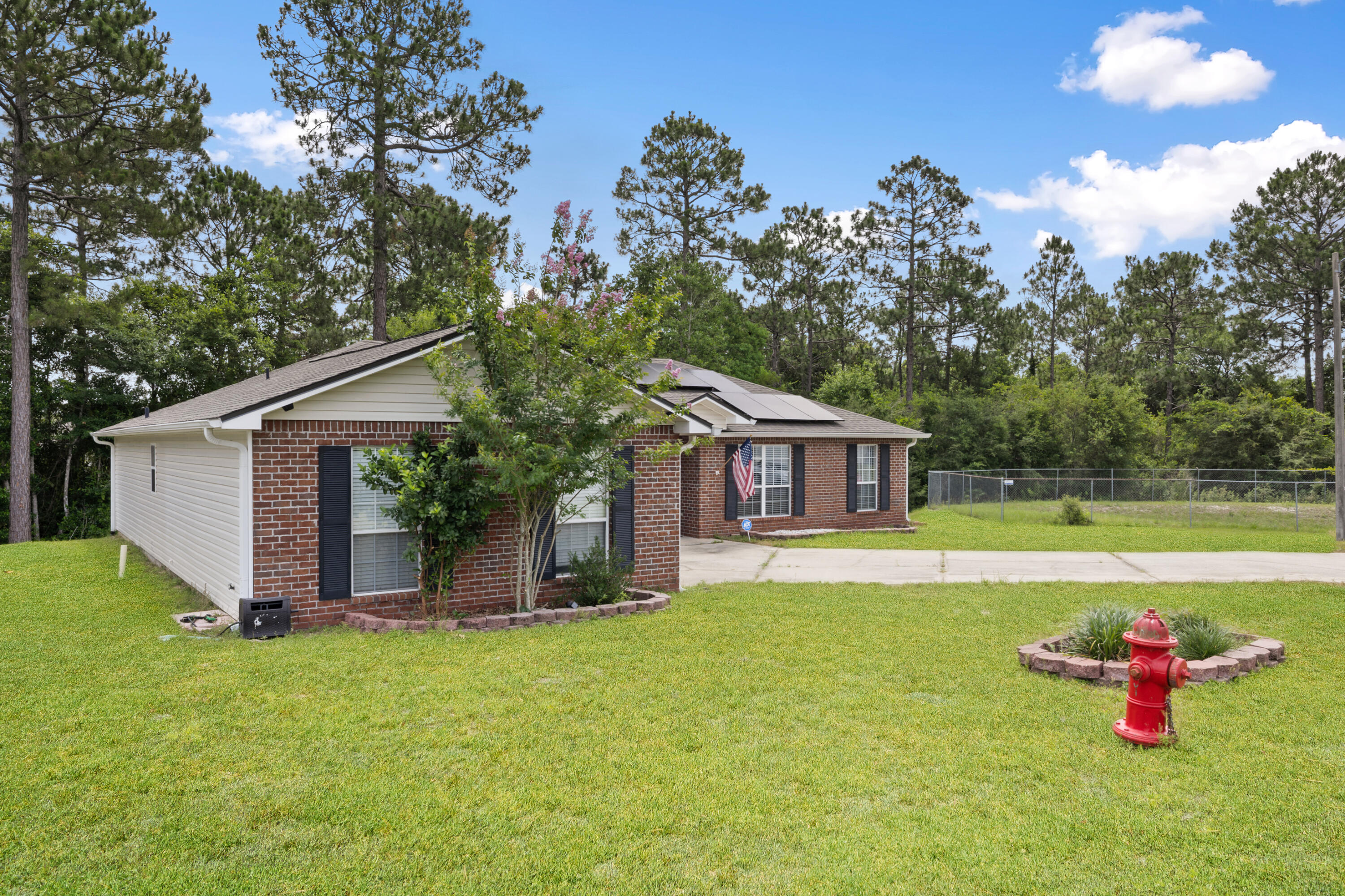 143 Sandstone Trail Crestview, FL 32539 - Photo 3 of 40 a house with swimming pool in front of it
