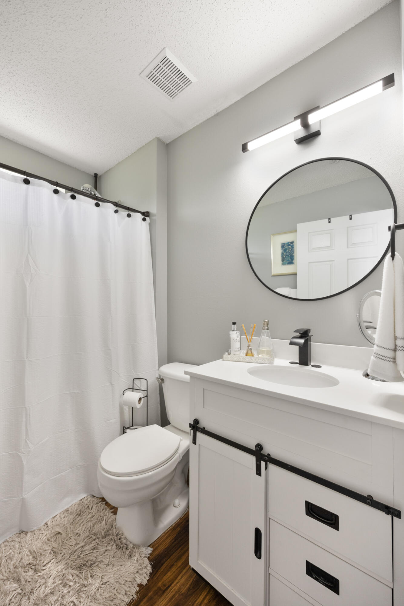 143 Sandstone Trail Crestview, FL 32539 - Photo 31 of 40 a bathroom with a sink a toilet and a mirror