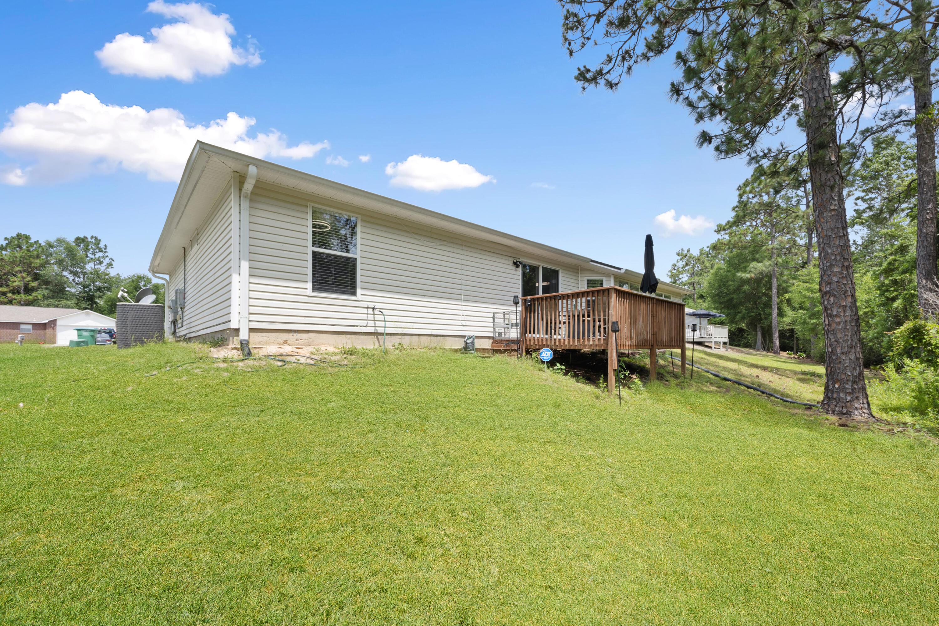 143 Sandstone Trail Crestview, FL 32539 - Photo 36 of 40 a house view with a garden space