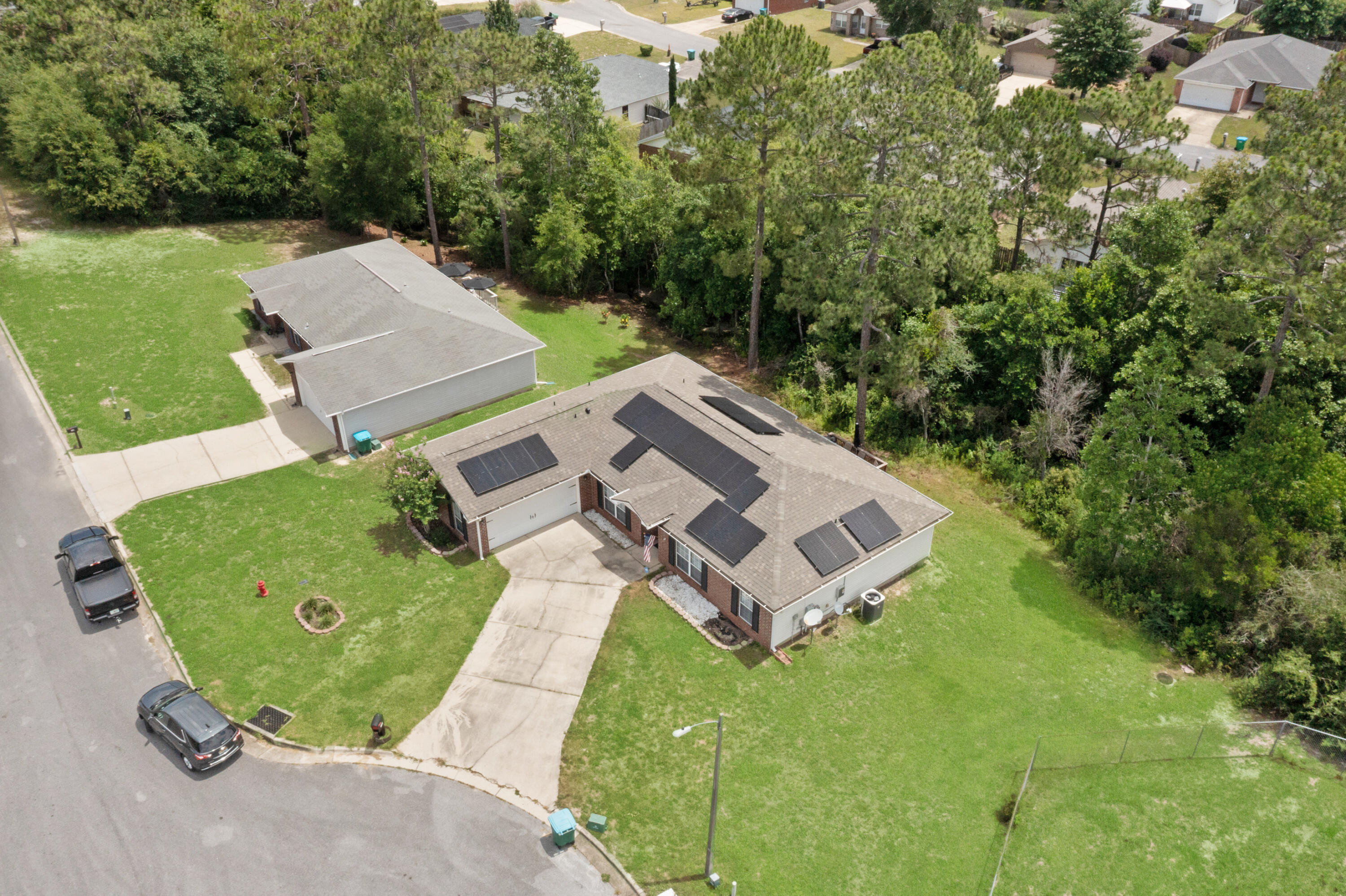 143 Sandstone Trail Crestview, FL 32539 - Photo 38 of 40 an aerial view of a house with a garden and trees