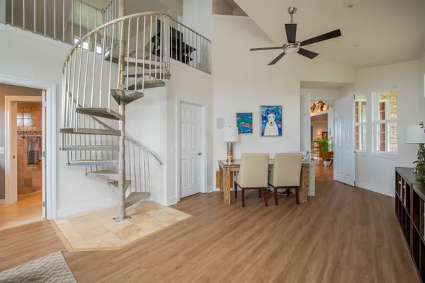a view of a terrace with couches and sky view