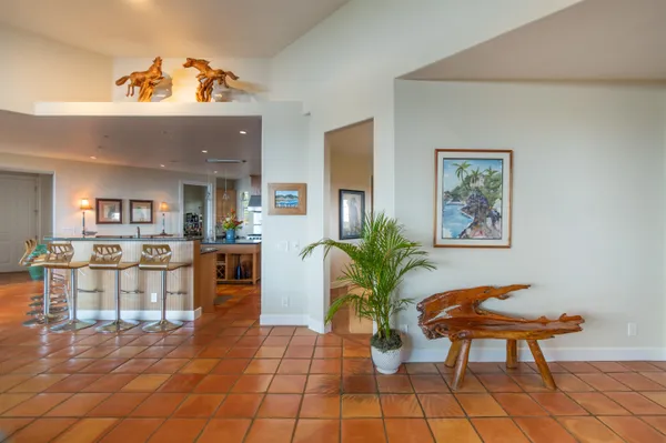 a lobby with furniture and a potted plant
