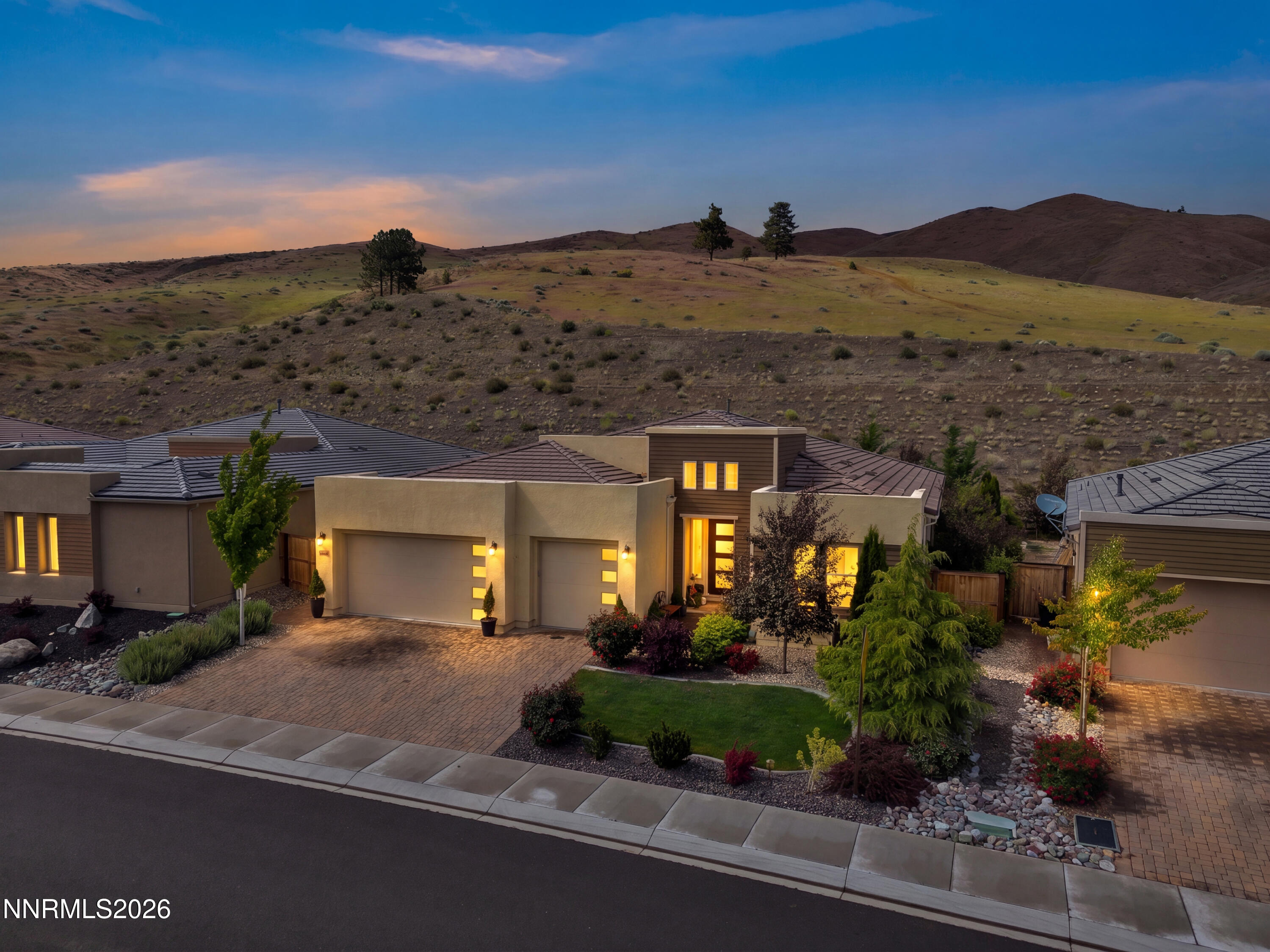 9021 Iron Sky Court Reno, NV 89523 - Photo 1 of 39 a view of a building with a mountain in the background
