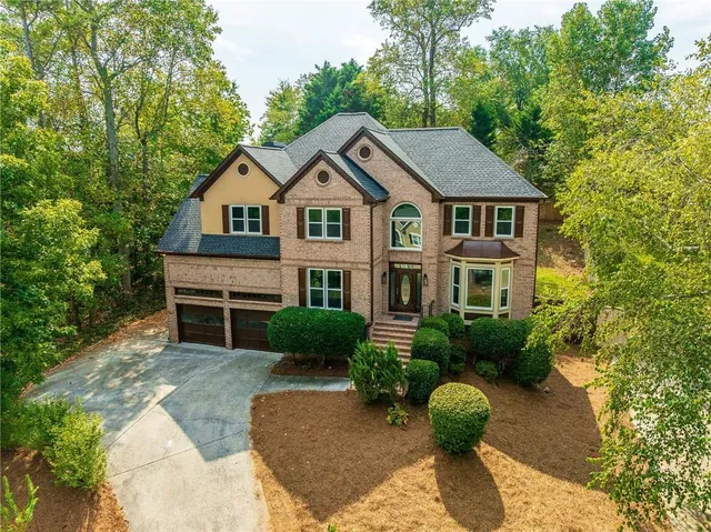 a front view of a house with garden