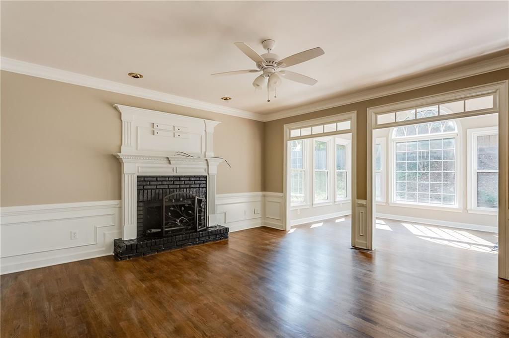 5719 Brookstone Walk Northwest Acworth, GA 30101 - Photo 15 of 54 wooden floor fireplace and windows in an empty room