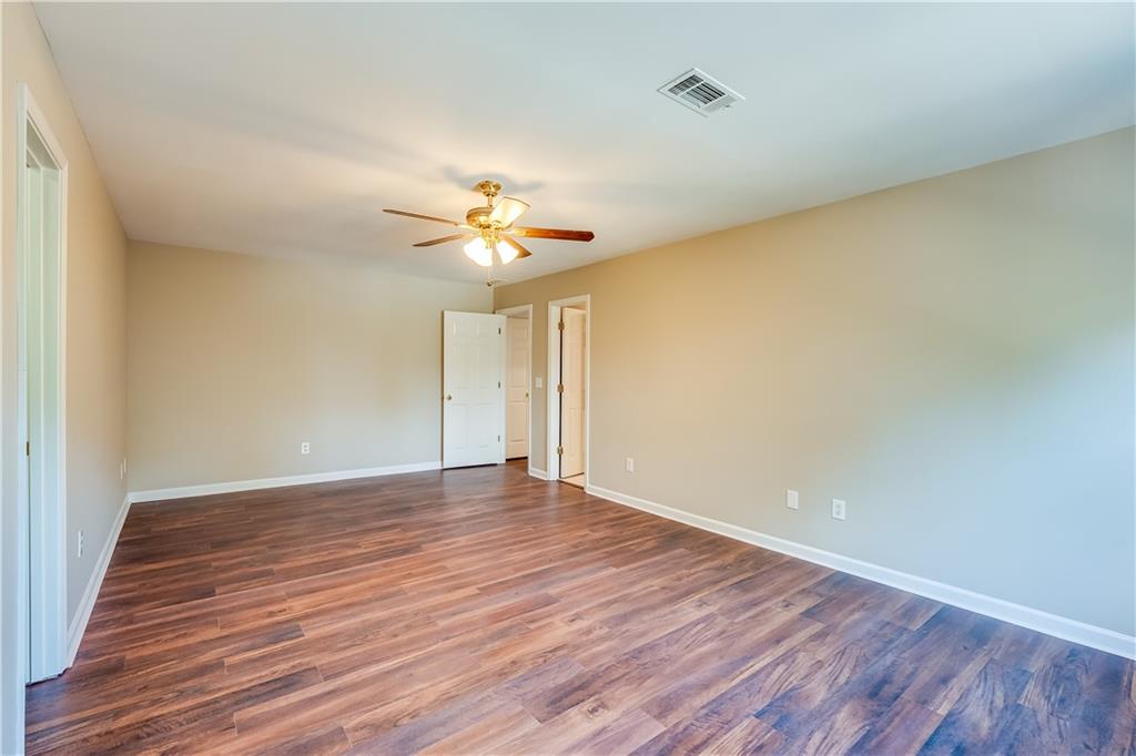 5719 Brookstone Walk Northwest Acworth, GA 30101 - Photo 19 of 54 a view of an empty room with wooden floor