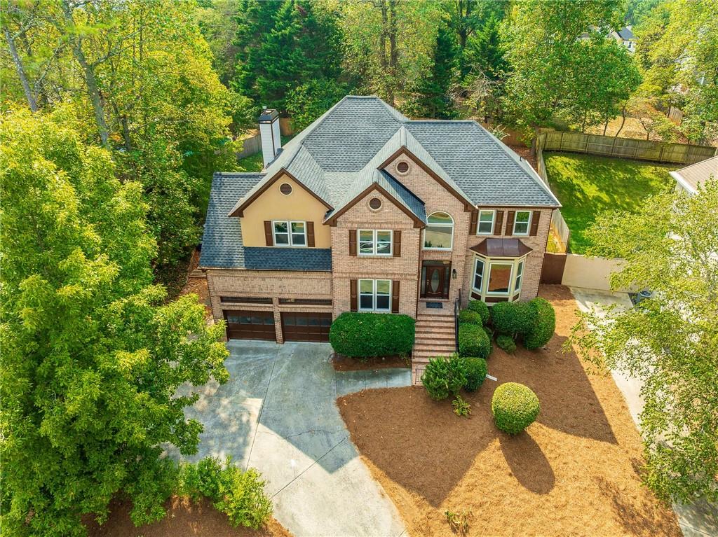 5719 Brookstone Walk Northwest Acworth, GA 30101 - Photo 2 of 54 a front view of a house with garden