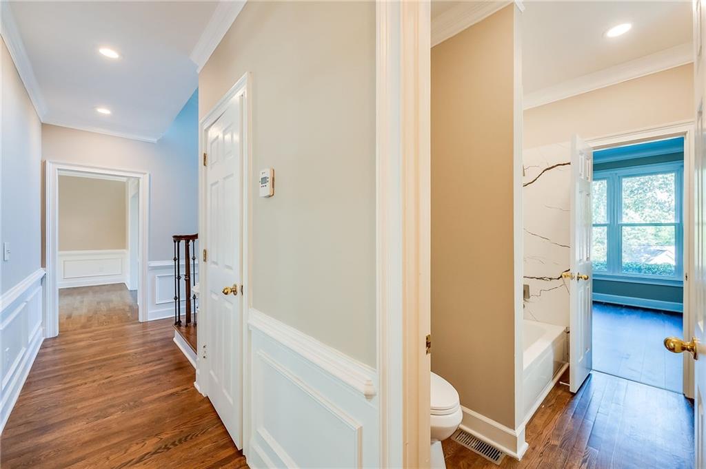 5719 Brookstone Walk Northwest Acworth, GA 30101 - Photo 21 of 54 a view of a hallway with wooden floor and staircase