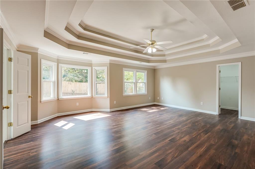 5719 Brookstone Walk Northwest Acworth, GA 30101 - Photo 23 of 54 a view of an empty room with wooden floor and a window