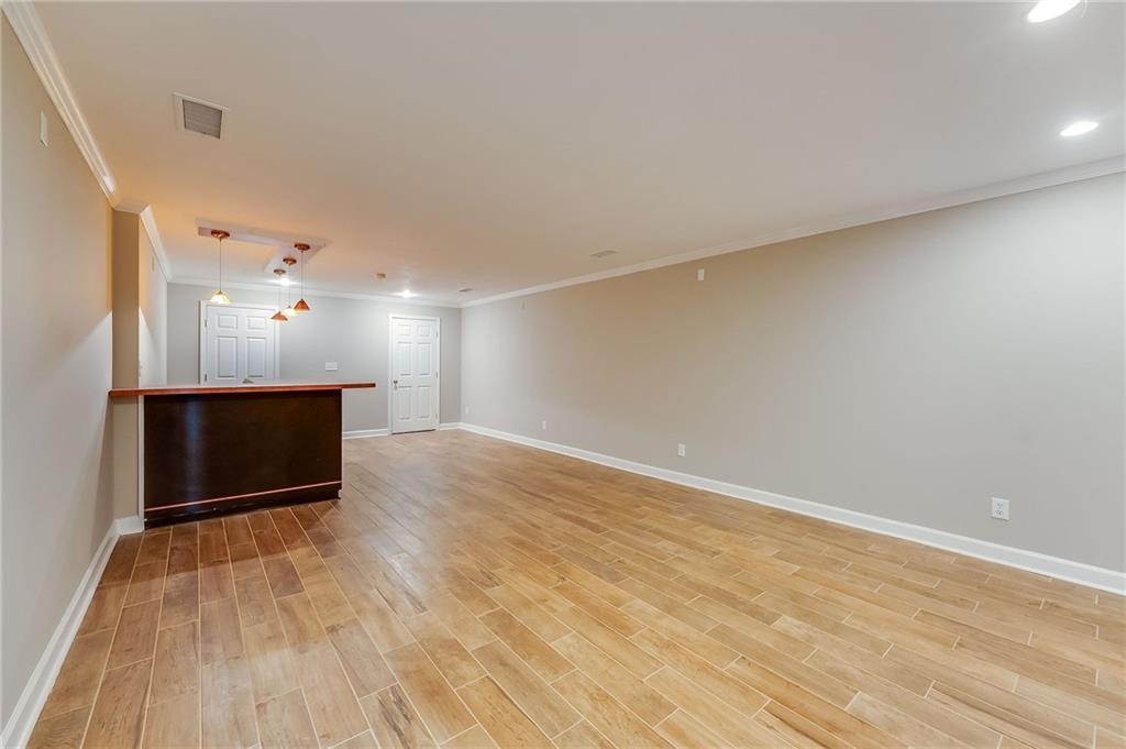 5719 Brookstone Walk Northwest Acworth, GA 30101 - Photo 30 of 54 wooden floor in an empty room with a window