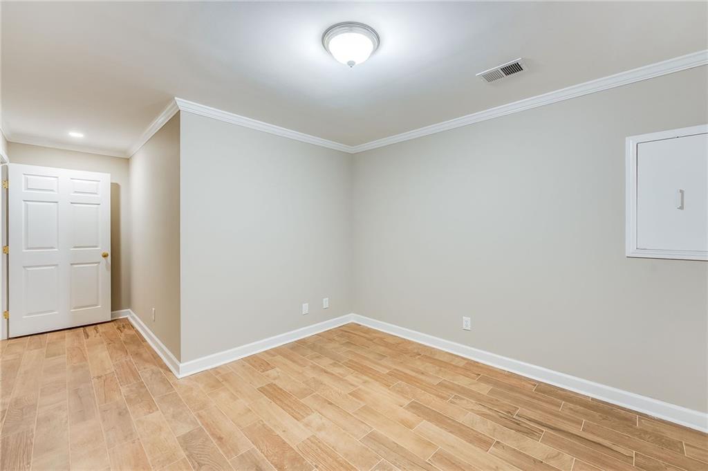 5719 Brookstone Walk Northwest Acworth, GA 30101 - Photo 33 of 54 wooden floor in an empty room with a window
