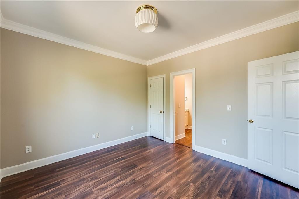 5719 Brookstone Walk Northwest Acworth, GA 30101 - Photo 36 of 54 a view of an empty room with wooden floor and window