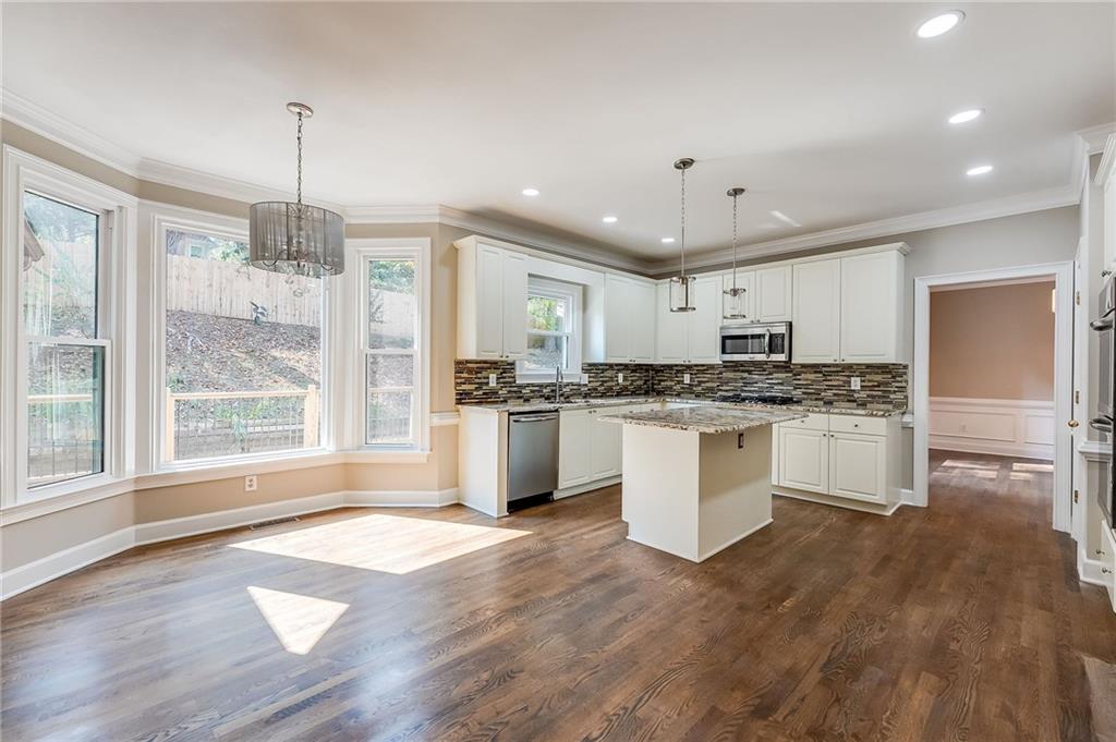 5719 Brookstone Walk Northwest Acworth, GA 30101 - Photo 10 of 54 a kitchen with a refrigerator and white cabinets