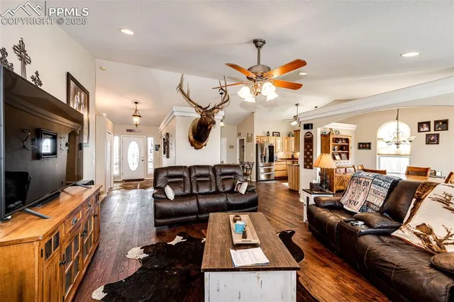 a living room with furniture and a flat screen tv