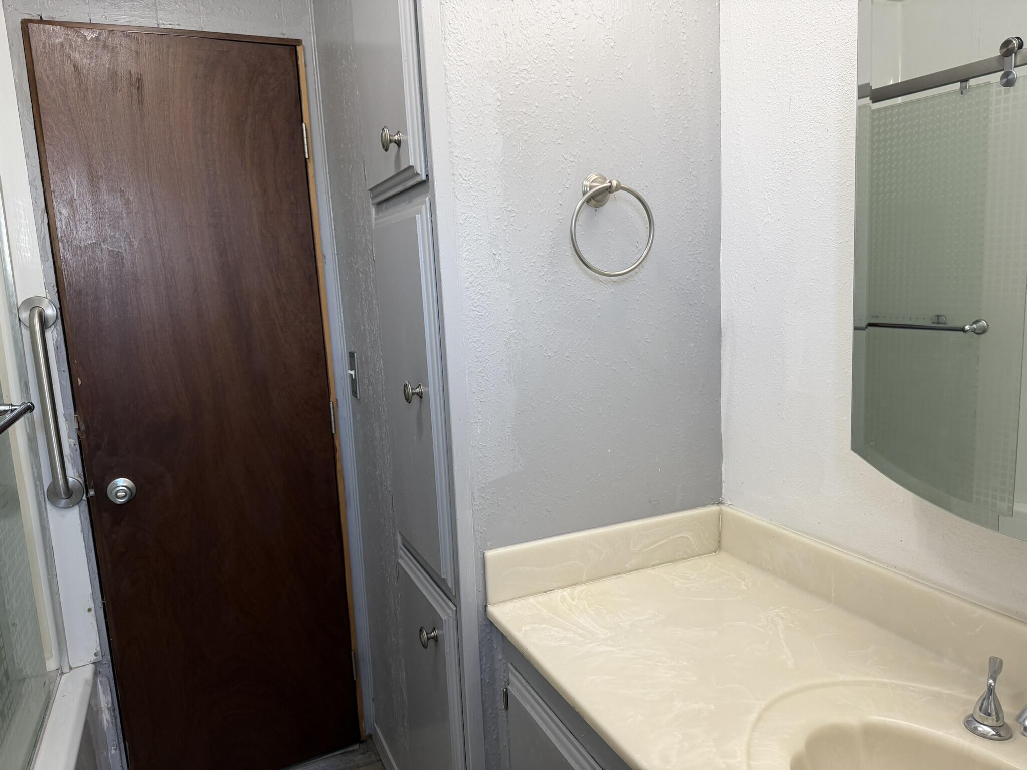 301 Freeman Road, Unit 70 Central Point, OR 97502 - Photo 17 of 39 a bathroom with a granite countertop sink and shower