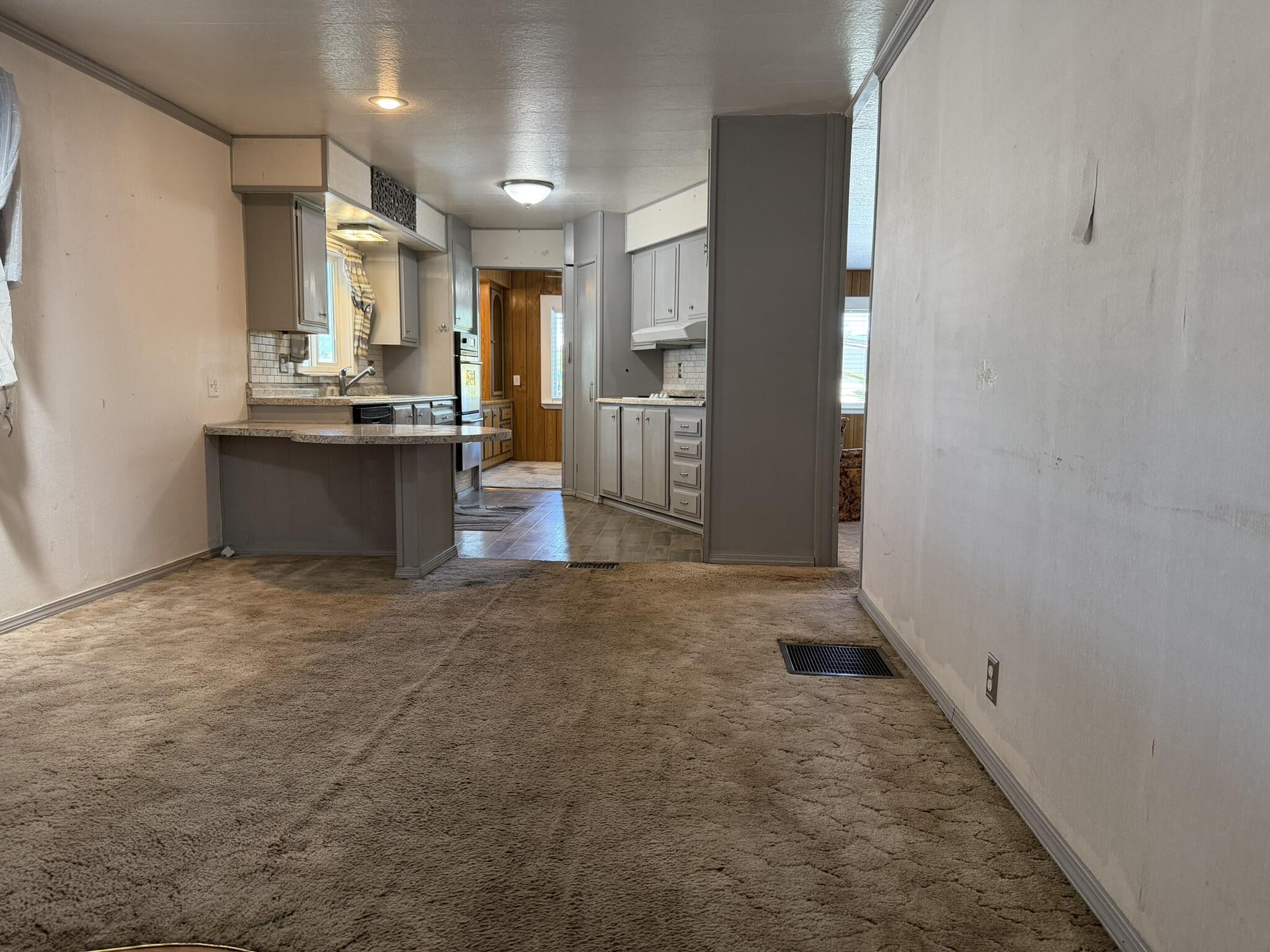301 Freeman Road, Unit 70 Central Point, OR 97502 - Photo 20 of 39 a view of a kitchen with refrigerator and a sink