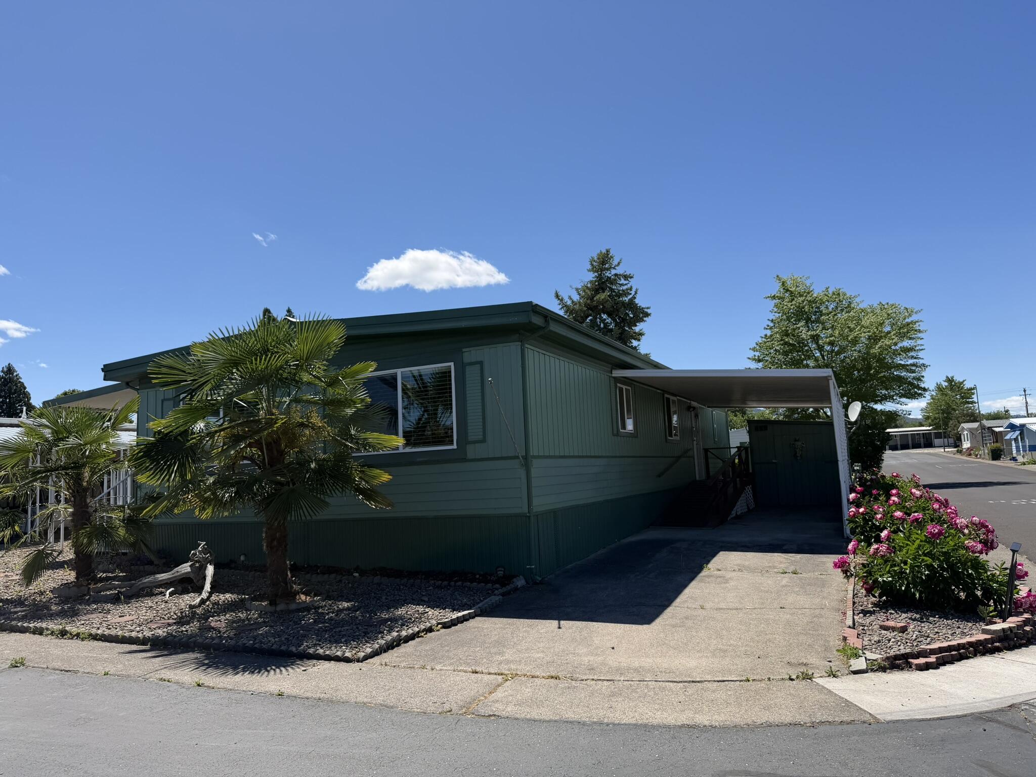 301 Freeman Road, Unit 70 Central Point, OR 97502 - Photo 2 of 39 a front view of a house with a yard