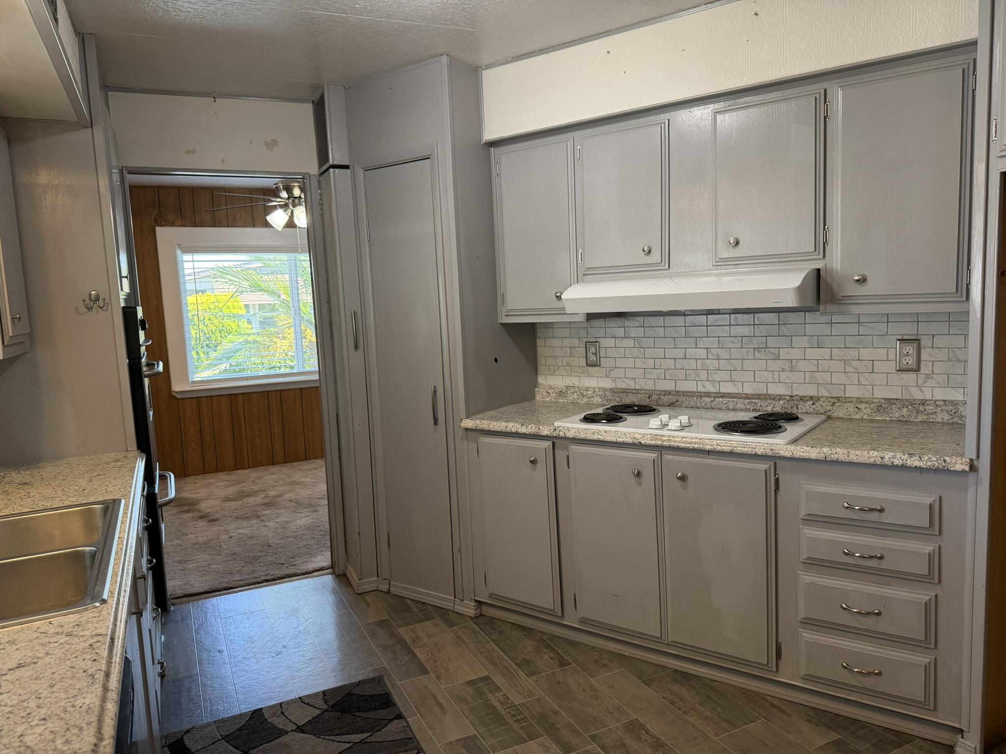 301 Freeman Road, Unit 70 Central Point, OR 97502 - Photo 25 of 39 a kitchen with a sink and cabinets