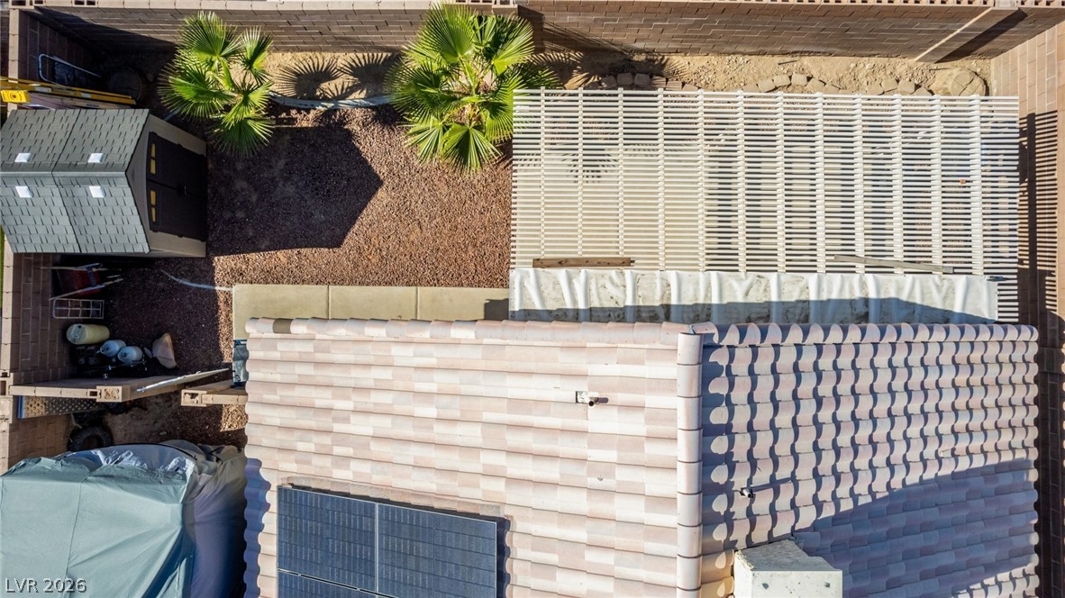 5112 West Camino Del Rancho Las Vegas, NV 89130 - Photo 44 of 44 An aerial perspective reveals the home's roof, solar panels, and a well-maintained yard.