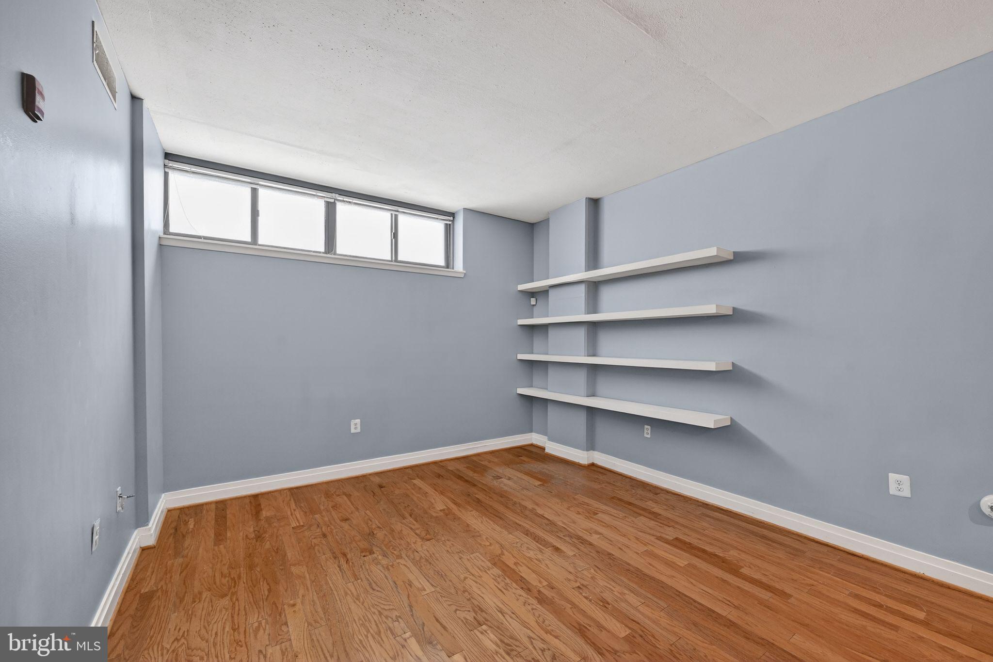 2120 Vermont Avenue Northwest, Unit 4 Washington, DC 20001 - Photo 20 of 24 a view of a room with shelf on the wall