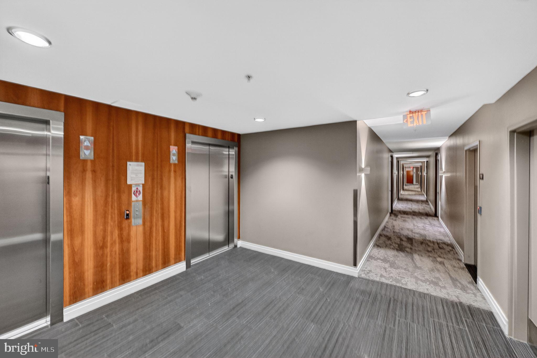 2120 Vermont Avenue Northwest, Unit 4 Washington, DC 20001 - Photo 23 of 24 a view of a hallway with wooden floor and closet area