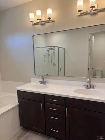 a bathroom that has a shower toilet and a sink