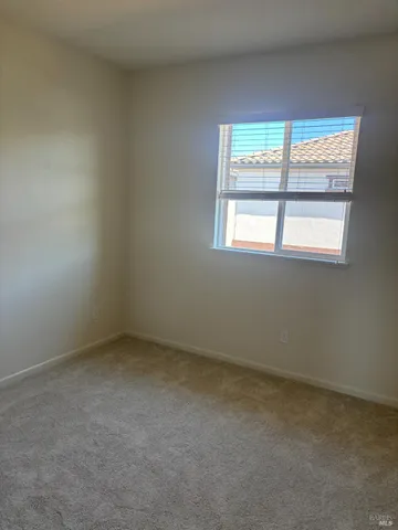 an empty room with closet area