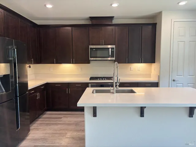a kitchen with a sink and cabinets