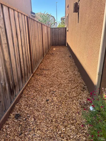 a view of a backyard with pathway