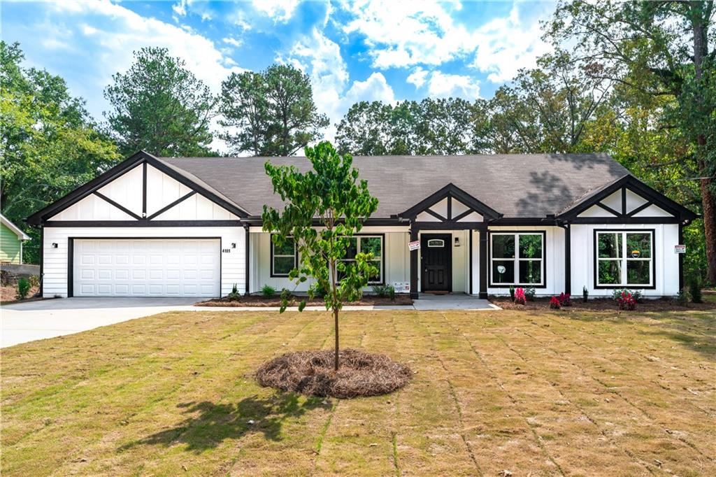 4181 Canby Lane Decatur, GA 30035 - Photo 1 of 1 a front view of a house with a yard and garage