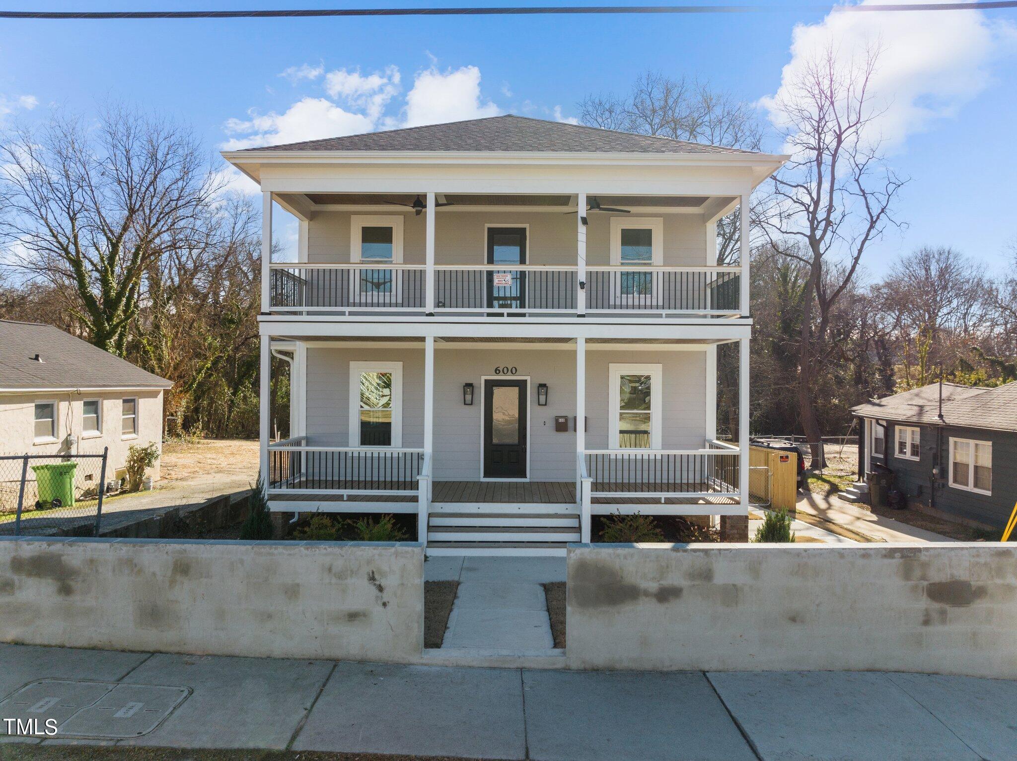 600 Bragg Street Raleigh, NC 27610 - Photo 1 of 68 a front view of a house with lots of white furniture