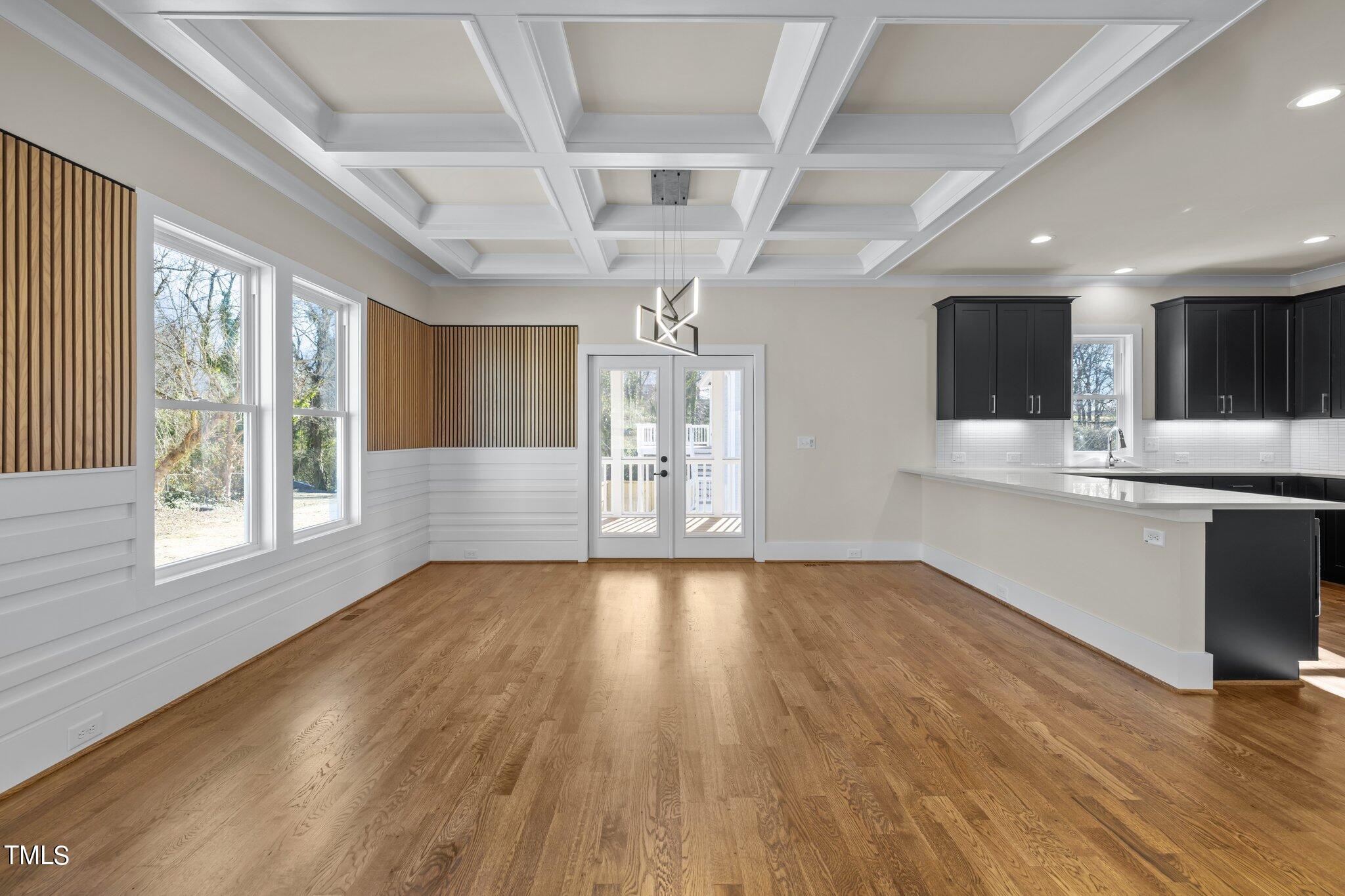 600 Bragg Street Raleigh, NC 27610 - Photo 9 of 68 a view of an empty room with wooden floor and a window