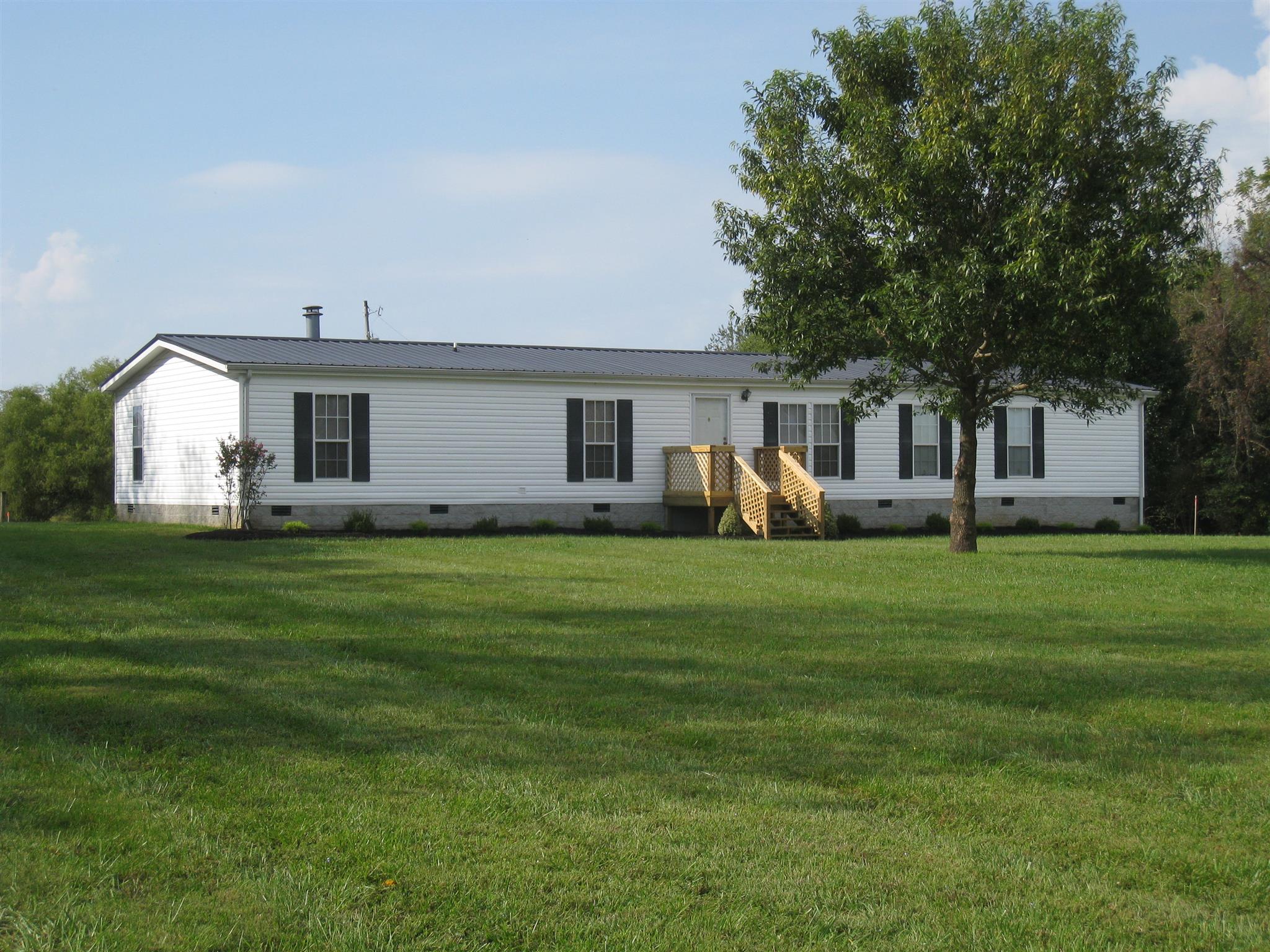 110 Snider Perry Road Portland, TN 37148 - Photo 1 of 24 a front view of house with yard outdoor seating and green space