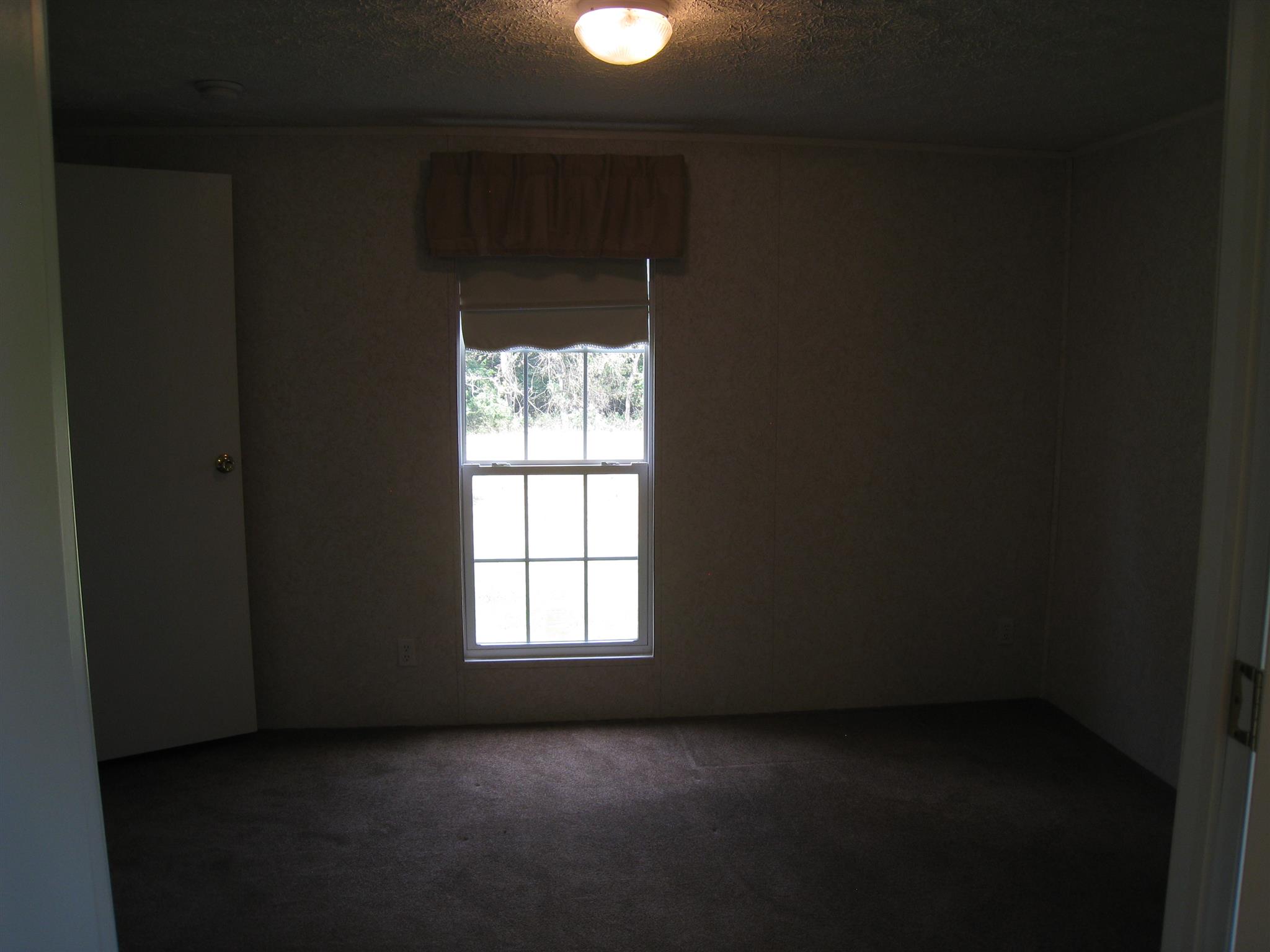 110 Snider Perry Road Portland, TN 37148 - Photo 18 of 24 an empty room with a window