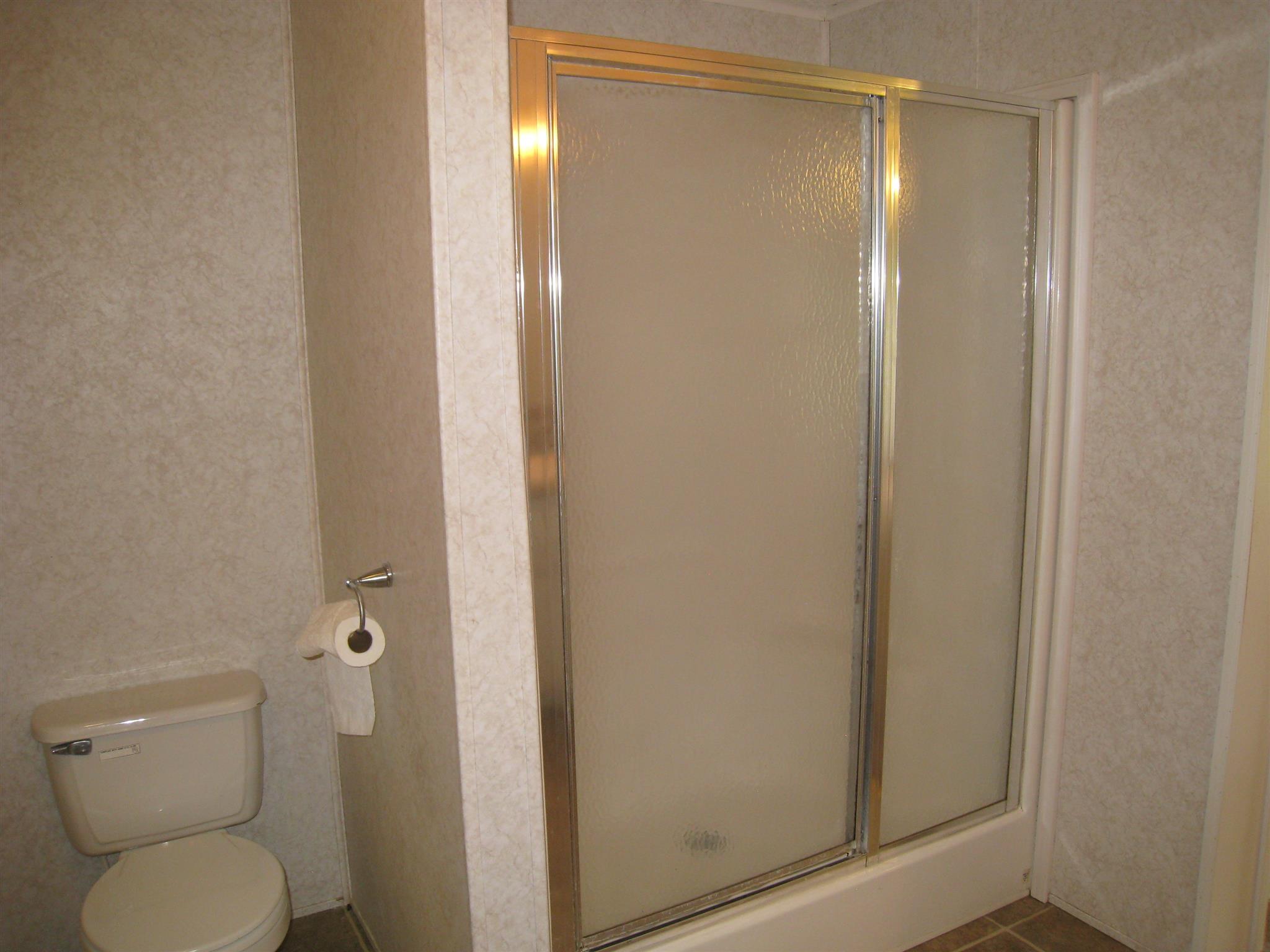 110 Snider Perry Road Portland, TN 37148 - Photo 21 of 24 a bathroom with a shower and a toilet