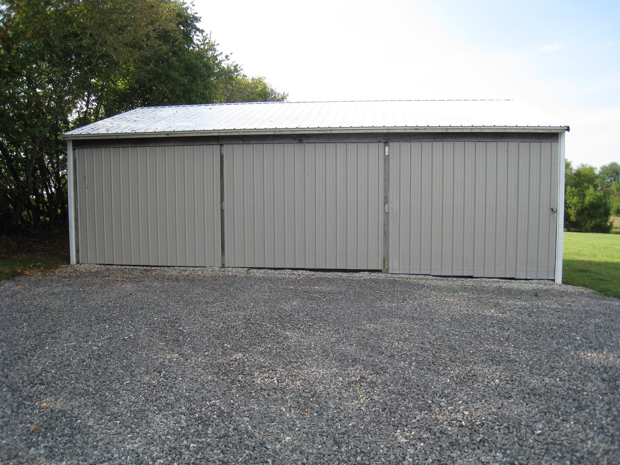 110 Snider Perry Road Portland, TN 37148 - Photo 4 of 24 a view of backyard and garage
