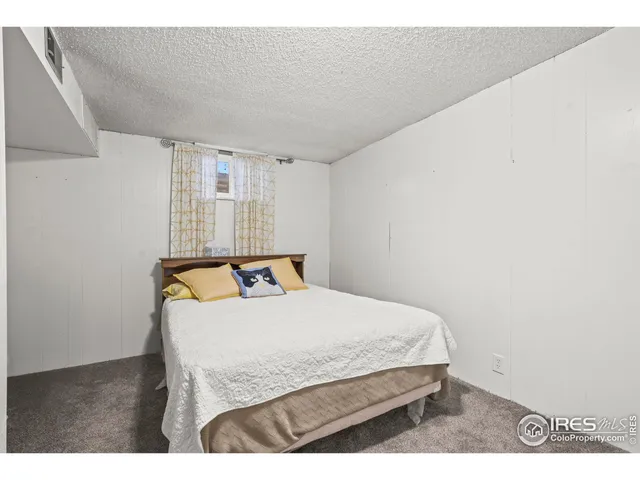 a bedroom with a bed and a table