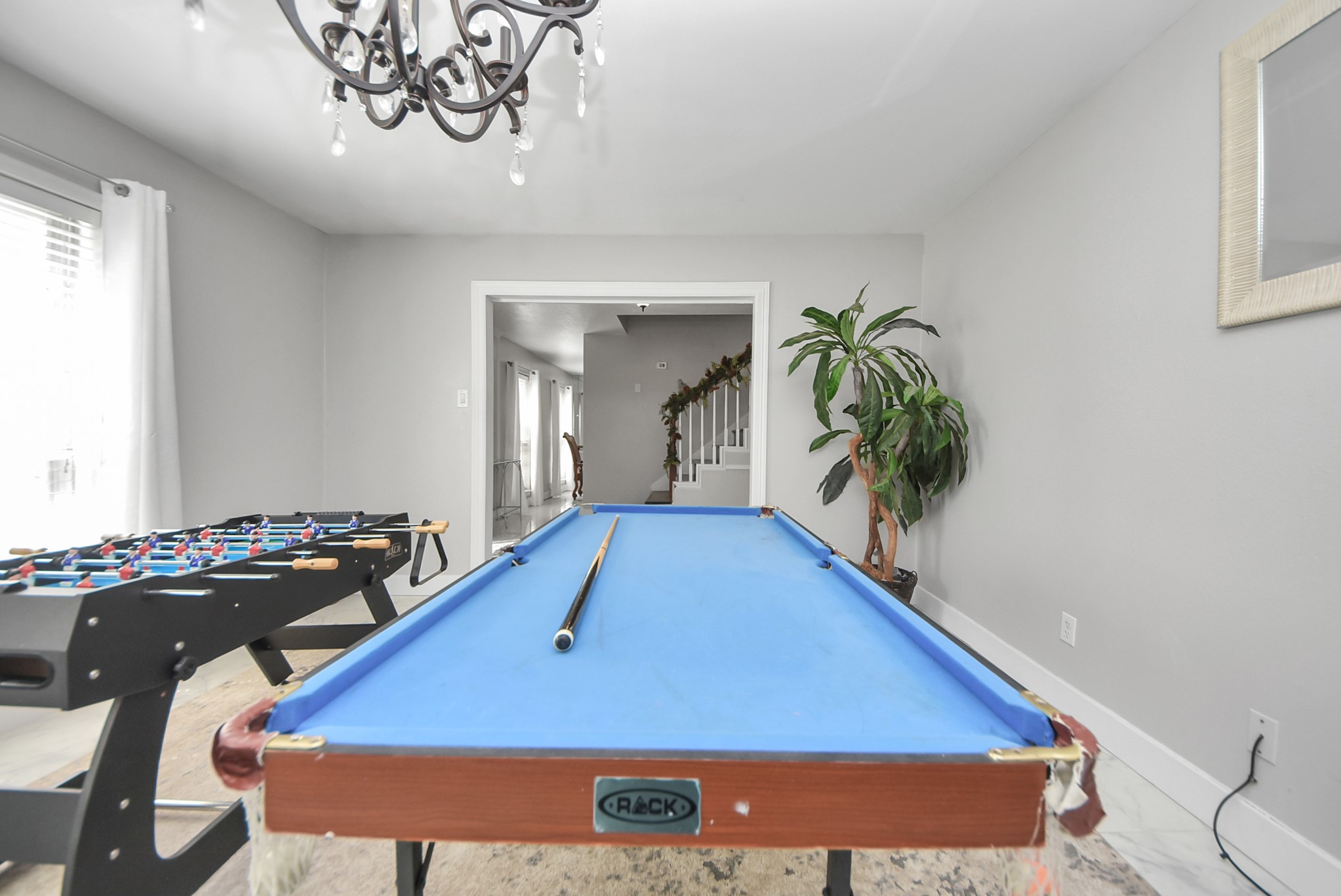1011 Whitestone Lane Houston, TX 77073 - Photo 28 of 48 a room with chandelier pool table and windows