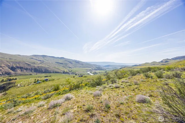 a view of mountain with an ocean
