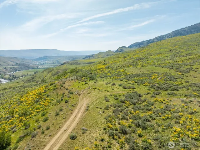 a view of an ocean from a mountain