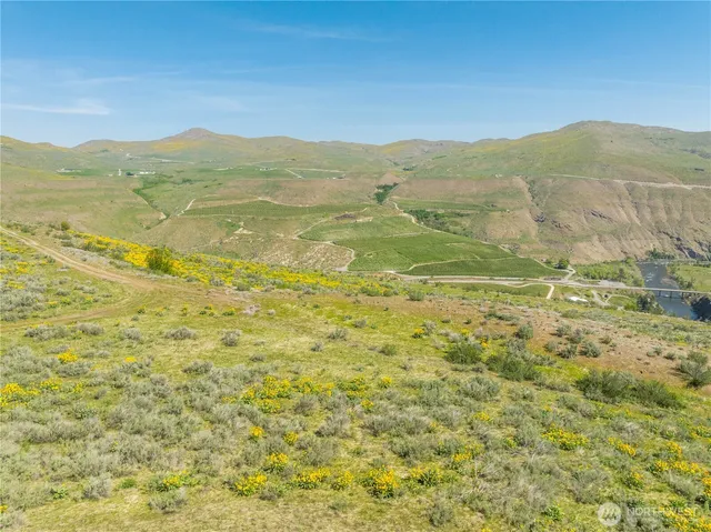 a view of mountain with an ocean
