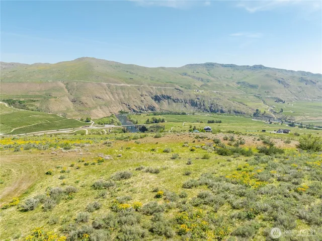 a view of a mountain with an ocean