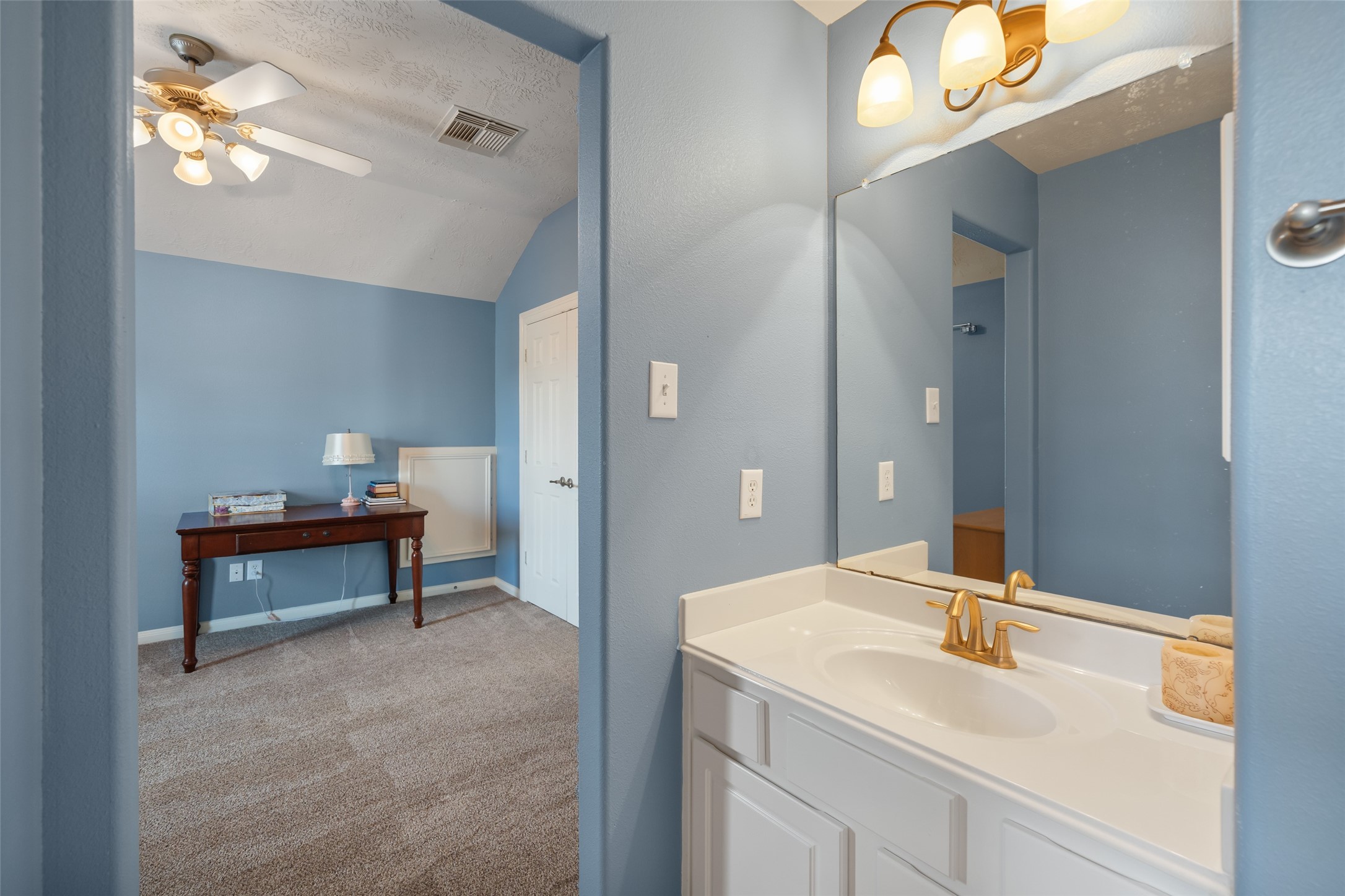 6407 Ashley Manor Drive Spring, TX 77389 - Photo 29 of 41 a en suite bathroom with a sink and a mirror
