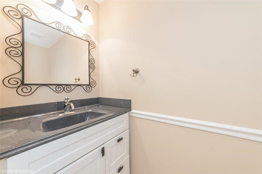 22494 Grouper Court Boca Raton, FL 33428 - Photo 15 of 22 a bathroom with a sink and a mirror