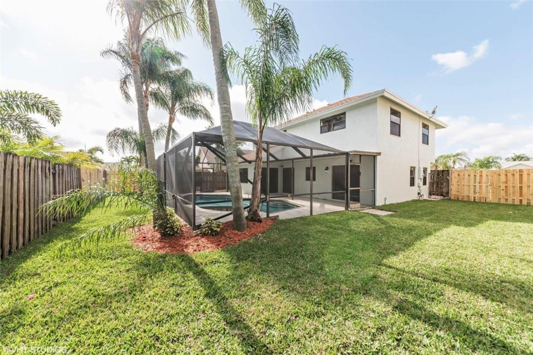 22494 Grouper Court Boca Raton, FL 33428 - Photo 21 of 22 a view of a house with backyard and sitting area