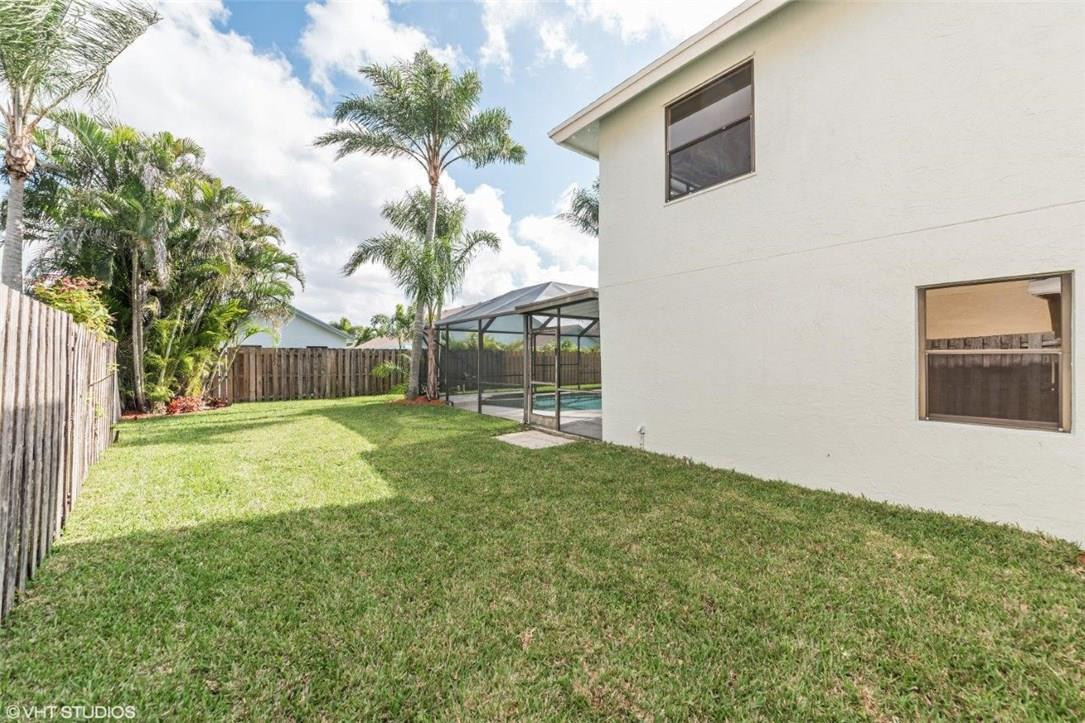 22494 Grouper Court Boca Raton, FL 33428 - Photo 22 of 22 a view of a backyard with a garden